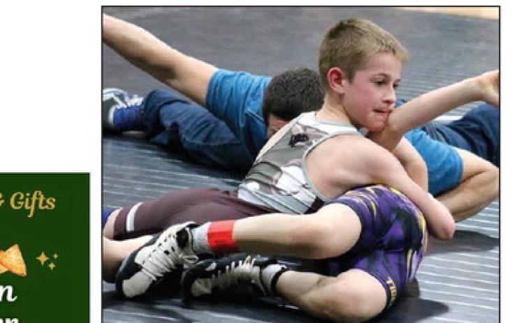 Crawford Maher of the Timber Lake Youth Wrestling Club tries to pin Kip Longbrake of Dupree during the Panther Invite last Thursday, March 1. Photos by Jon Flatland