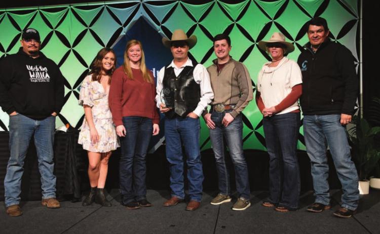 Zach Ducheneaux (CENTER) and the team at DX Ranch were recently honored as finalists for the 2021 Top Producer of the Year award at Farm Journal’s Top Producer Summit in Nashville. L-R are Bud Ducheneaux, Calico Ducheneaux, Melissa Loeschen, Zachary Ducheneaux, Ty Ducheneaux, Tausha Kraft-Ducheneaux, and Guthrie Ducheneaux. Not pictured: Kelsey Ducheneaux, Monte Scott, Burt Dillabaugh, and the rest of the family and friends back home on CRST. Photo by Chuck Zimmerman, Top Producer