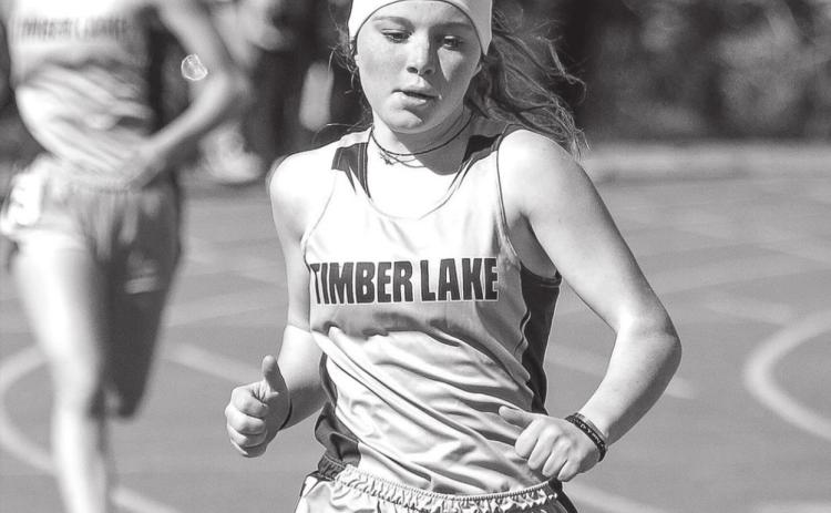 Timber Lake’s Kenlea Heck runs in the 400 meter race at TL’s early track meet File photos by Jon Flatland