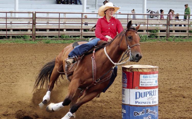 Jazmyn Longbrake of Dupree leans in as her horse makes the final turn during barrel racing action Saturday, July 19, at the 4-H regional rodeo in Dupree. No results were posted by the time this issue of the Topic went to press. Photo by Jon Flatland