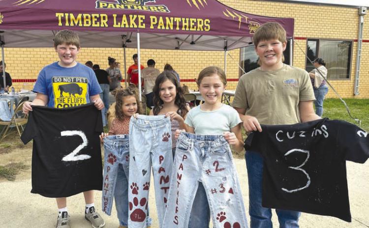The Timber Lake Booster Club had a jeans and shirts painting booth at the Homecoming Kick-off on Sunday afternoon. Showing their handiwork are (l-r) Brody Kraft, Jensyn Booth, Blake Booth, Joey Kraft, and Monroe Kraft.