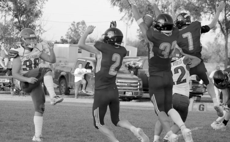Braydon Terveen-Smith (32) blocks a Potter County punt during the Dupree Tigers win over the Battlers last Friday, Sept. 13. Rushing the punter with him were Cruz Birkeland (2) and Fletcher Birkeland (7). Cruz Birkeland ended up scooping up the blocked kick and tumbling into the end zone for a touchdown. Photo by Jon Flatland