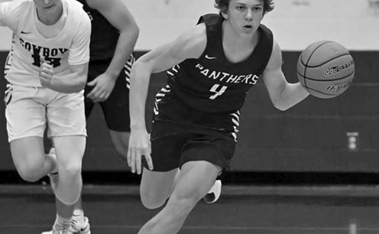 Panther guard Broc Bauer pushes the ball upcourt on a fast-break during varsity boys hoops action. Bauer poured in a game-high 22 points to lead the Timber Lake JV squad over Mobridge-Pollock. Topic photo by Marie DuPreez